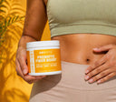 Person holding a container of GoBoitix Prebiotic Fiber Boost against a yellow background